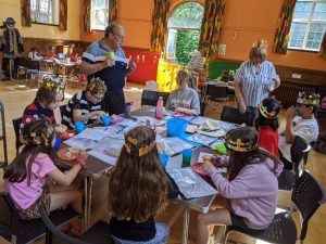 Children sat around a table taking part in Supersleuth ctivies